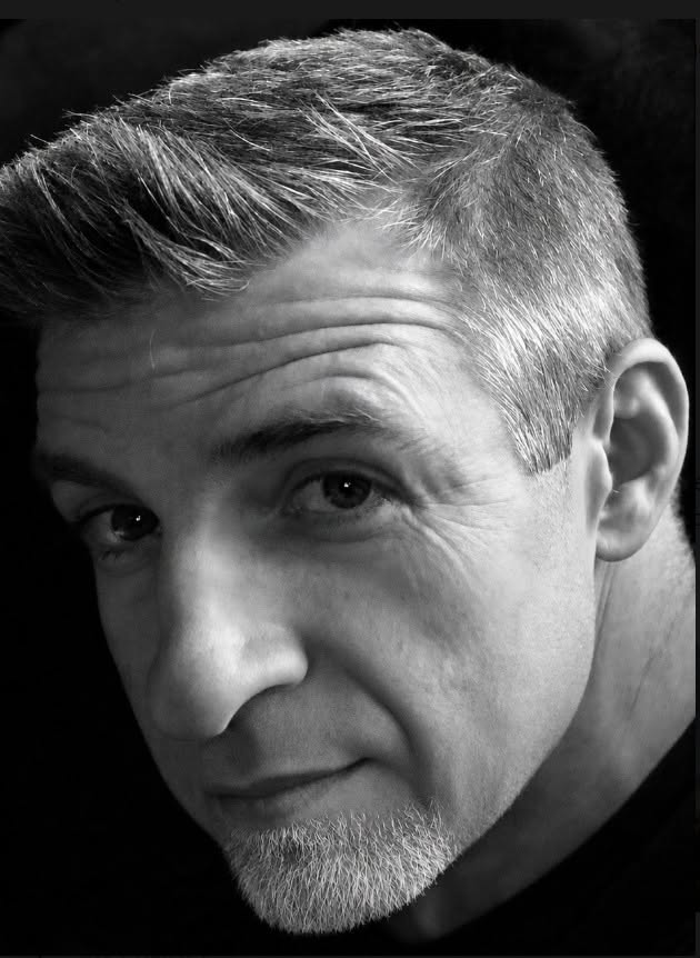 Black-and-white portrait of author Mike Feil